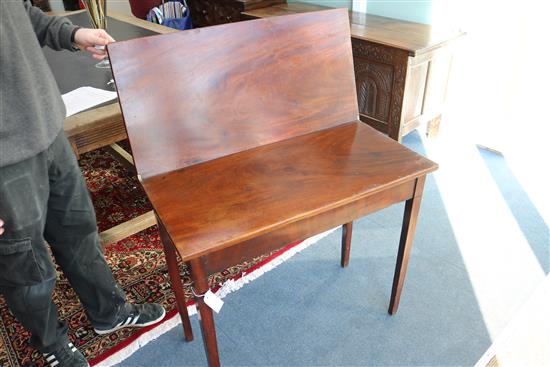 A George III mahogany tea table W.85cm